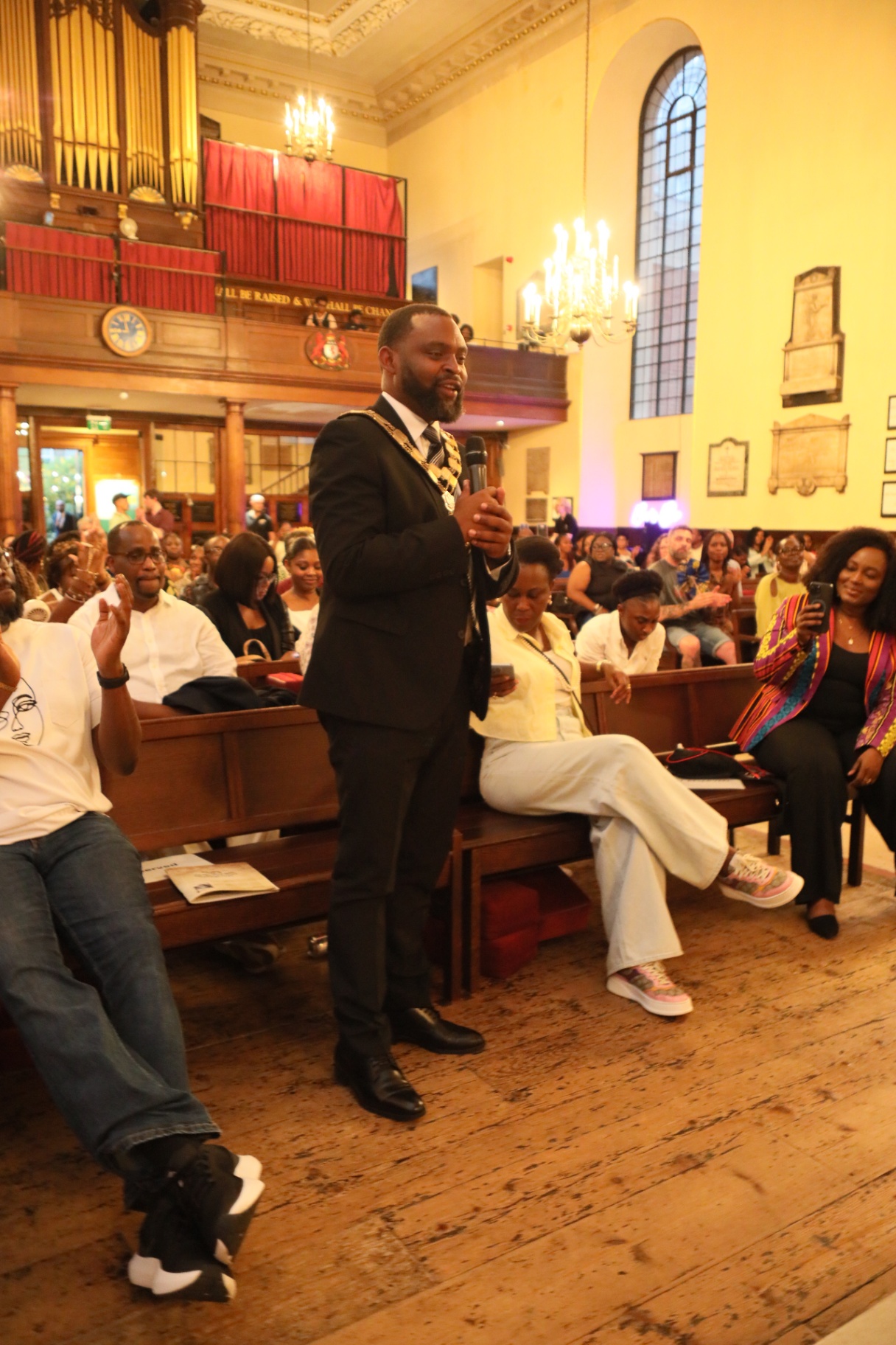 Mayor addressing the audience with chain of office