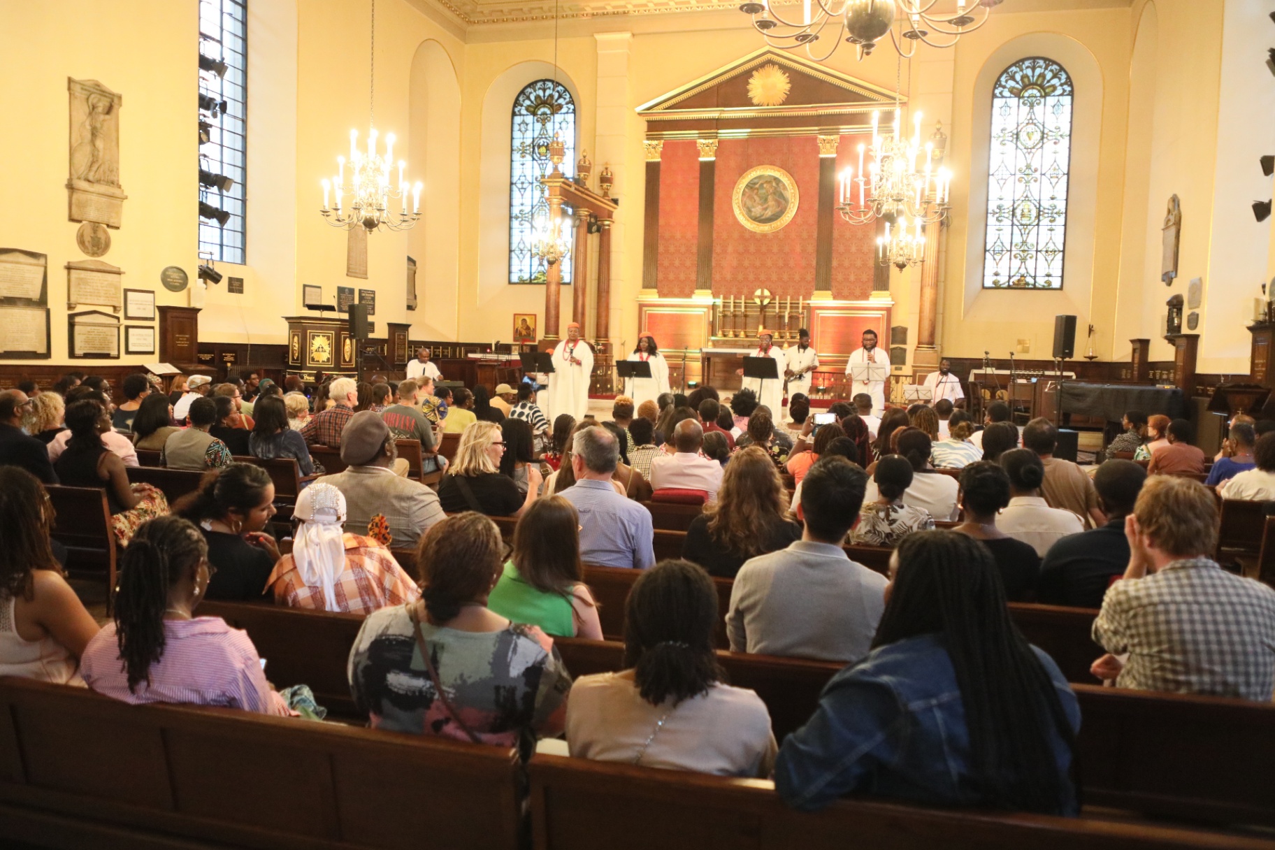 Full church audience watching the ensemble perform