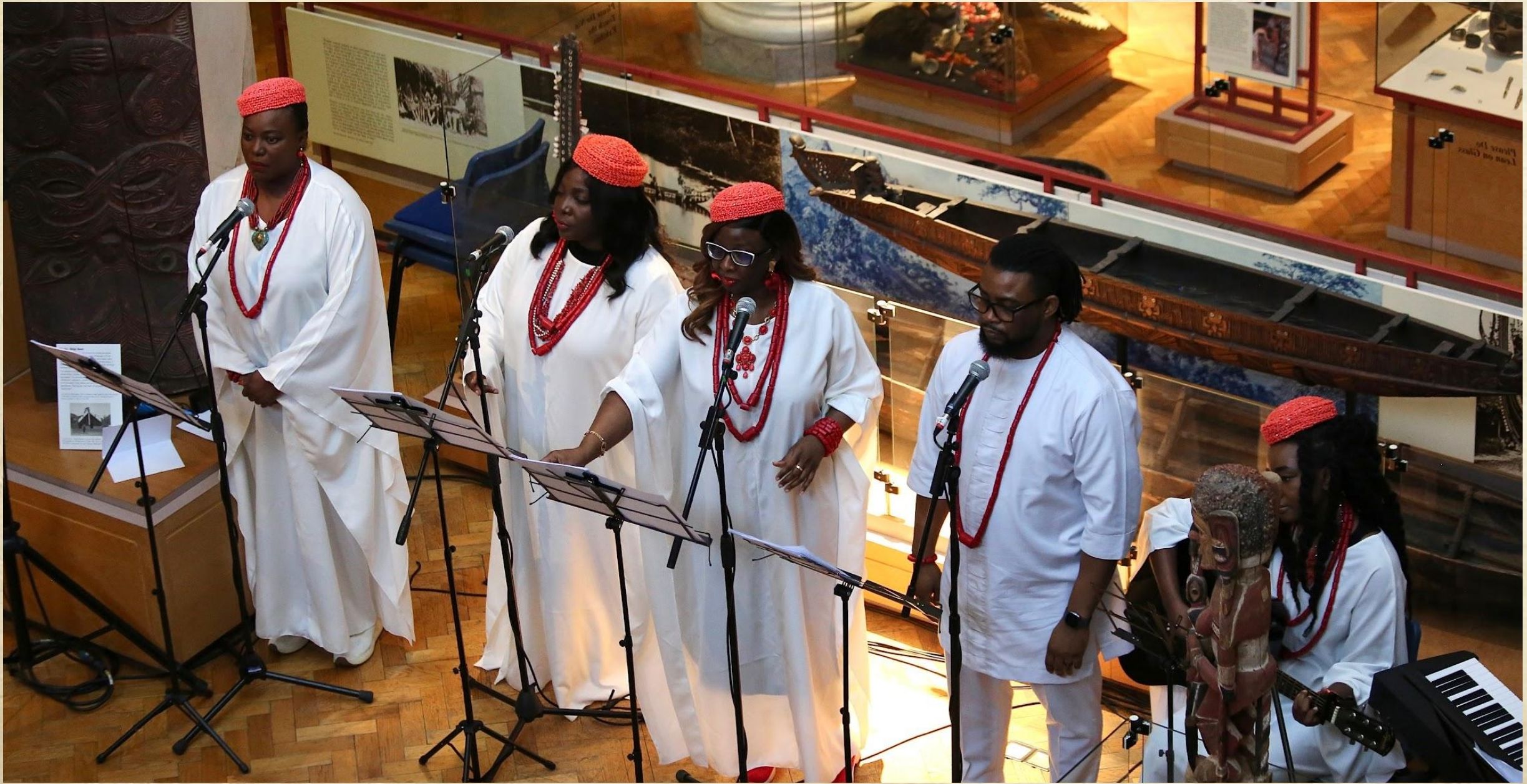 Performers singing into microphones